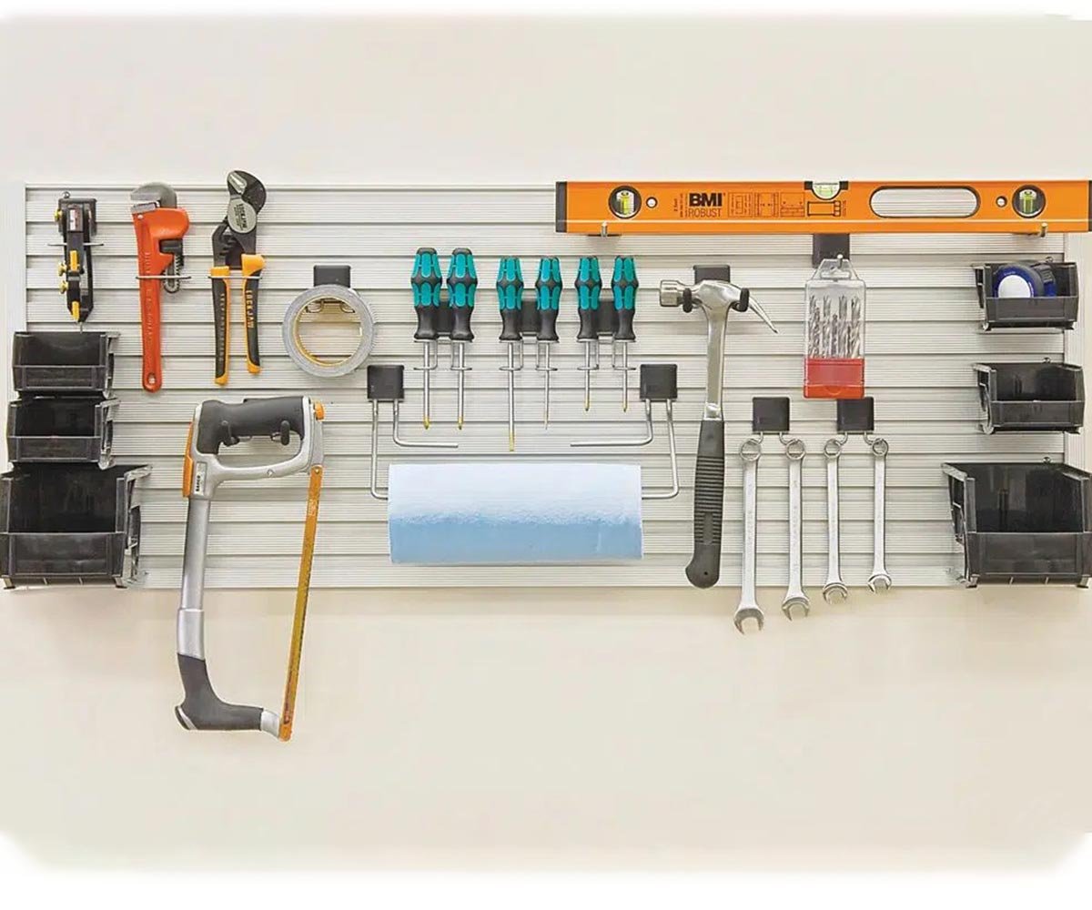 Custom garage wall system with heavy-duty hooks and cabinets