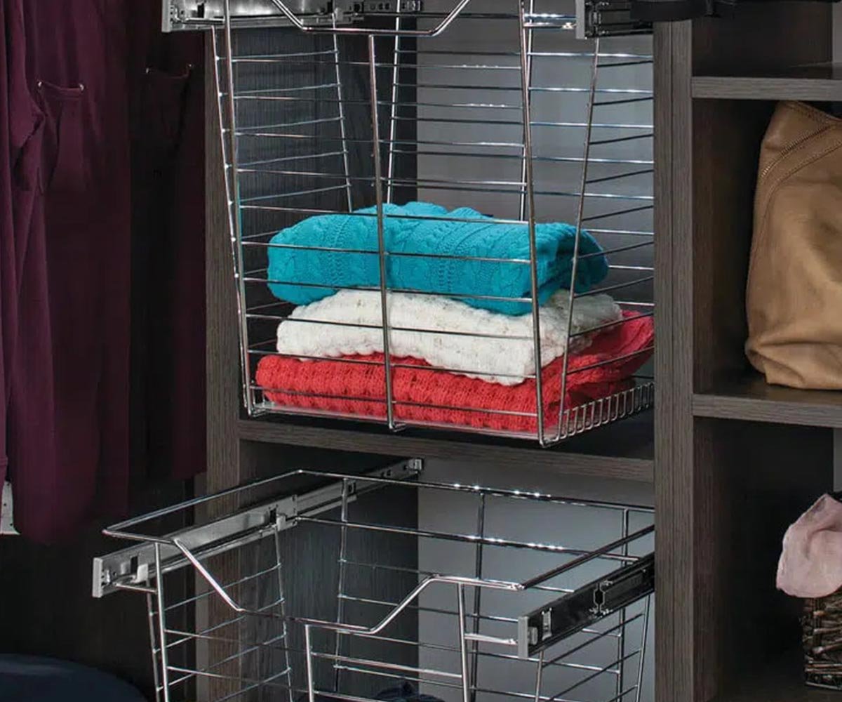 Custom laundry room accessories with pull-out hamper and folding surface
