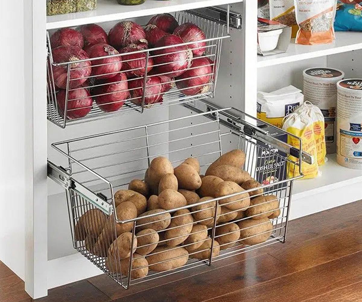 Custom pantry accessories with pull-out baskets and mixed-depth shelves