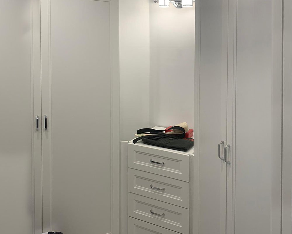 Nova walk-in closet with drawers and open shelving