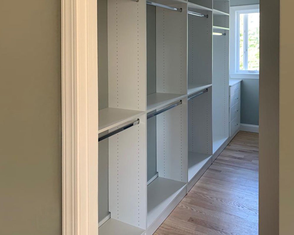 Walk-in closet with long hanging and shoe shelves