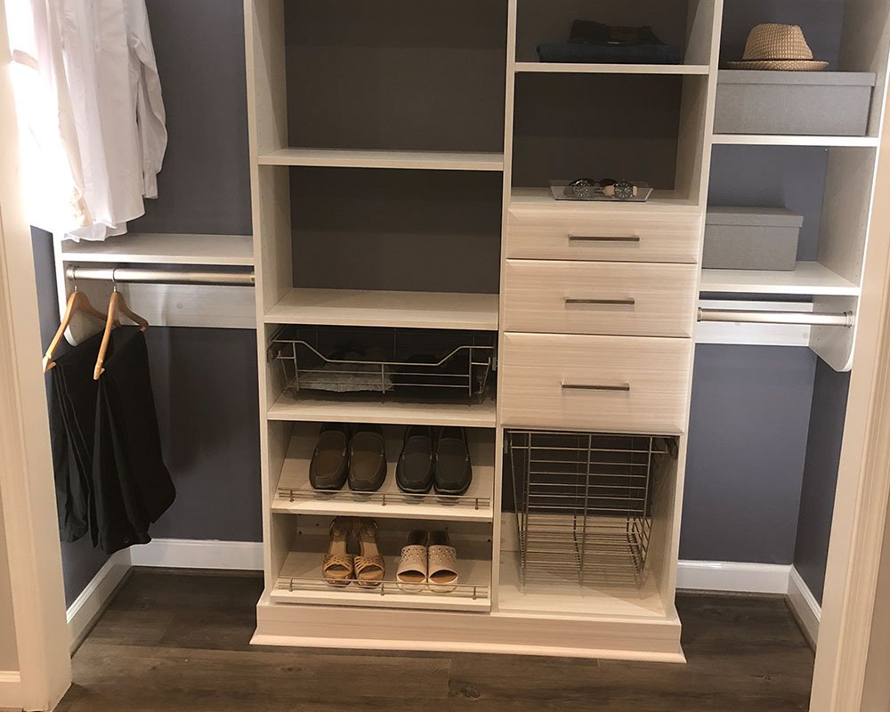 Walk-in closet island with drawers in a Virginia home