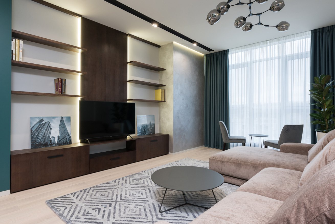 TV wall with closed cabinets and cable management