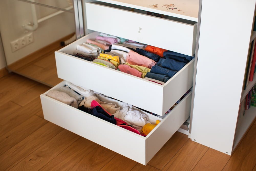 Kids closet with low hanging and open cubbies